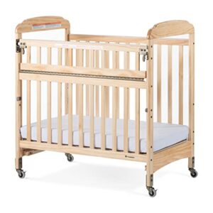 foundations serenity safereach crib with adjustable mattress board, compact baby crib with commercial grade casters, clear end panels for child visibility, includes 3” foam mattress (natural)