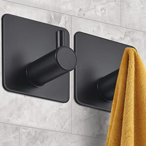 yogeernic 2 pcs adhesive towel hooks for wall, no drilling removable wall hooks for hanging, heavy duty robe and towel hooks for bathroom bedroom kitchen hotel(matte black)