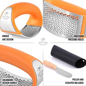 Zulay Stainless Steel Garlic Press Rocker Set - Premium Garlic Mincer With Silicone Peeler & Scraper - Arc Shape Design Garlic Crusher With Comfortable Grip (Orange)