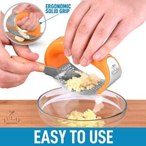 Zulay Stainless Steel Garlic Press Rocker Set - Premium Garlic Mincer With Silicone Peeler & Scraper - Arc Shape Design Garlic Crusher With Comfortable Grip (Orange)