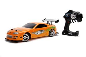 jada toys fast & furious 1:10 toyota supra remote control car drift slide rc with extra tires 2.4ghz, toys for kids and adults, orange,black