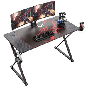 eureka ergonomic gaming desk 47 inch,pc gaming table, x shaped gaming computer desk with mouse pad, carbon fiber home office desk with cup holder & headphone hook & controller stand,black