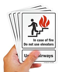 SmartSign (Pack of 4) 7 x 5 inch “in Case of Fire Do Not Use Elevators, Use Stairways” Sticker Labels with Symbol, 5 mil Laminated Polyester with SuperStick Adhesive, Red, Black and White