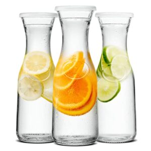 kook glass carafe pitchers, beverage dispensers, clear jugs for mimosa bar, water, wine, milk and juice, with plastic lids, dishwasher safe, 35 oz, set of 3