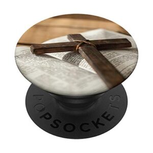 dark brown cross with rope on open bible verses book popsockets grip and stand for phones and tablets