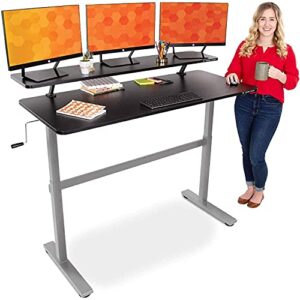 stand steady tranzendesk 55 in standing desk with clamp on shelf | easy crank height adjustable stand up workstation w/attachable monitor riser | holds 3 monitors & adds desk space (55/silver base)