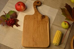 rectangular wooden cutting board made of solid wood. size: total length - 13.38 inches, width - 6.29 inches, thickness - 0.78 inches. the handle length is 4.72 inches.