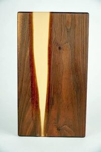amber creek walnut and amber epoxy cutting board and charcuterie board