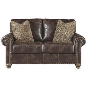 signature design by ashley nicorvo vintagel faux leather loveseat with gold nailhead trim, brown
