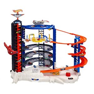 hot wheels toy car track set & 4 1:64 scale cars, super ultimate garage, 3+ ft tall with motorized gorilla & storage for 140 cars
