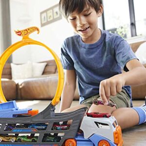 Hot Wheels Stunt & Go Track Set with 1 Toy Car, Transforming Hauler Truck with Launcher, Stores 18 1:64 Scale Cars [Amazon Exclusive]