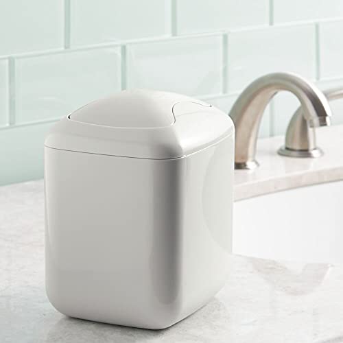 mDesign Modern Plastic Square Mini Wastebasket Trash Can Dispenser with Swing Lid for Bathroom Vanity Countertop or Tabletop - Dispose of Cotton Rounds, Makeup Sponges, Tissues - 2 Pack - Light Gray