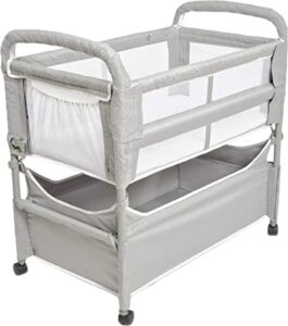 arm’s reach clear-vue co-sleeper bedside bassinet featuring clear mesh panels with fold-down side, large attached storage basket, 4 wheels, and height-adjustable legs