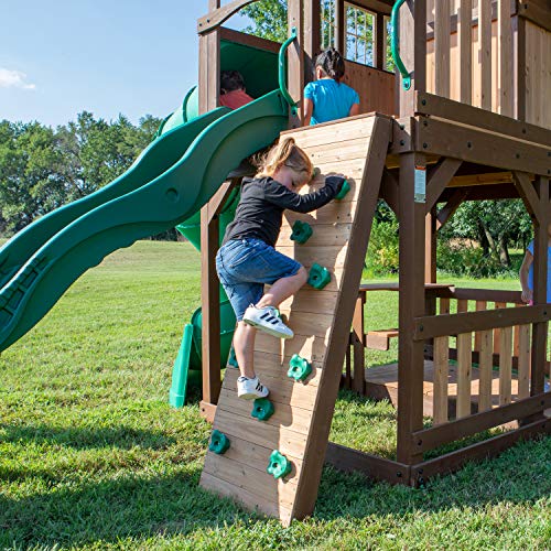 Backyard Discovery Skyfort All Cedar Swing Set, Elevated Covered Wood Roof Clubhouse with Bay Windows, 2 Belt Swings, Web Swing, 10ft Wave Slide, 5 ft Tube Slide, Covered Picnic Table, 5 ft Rock Wall