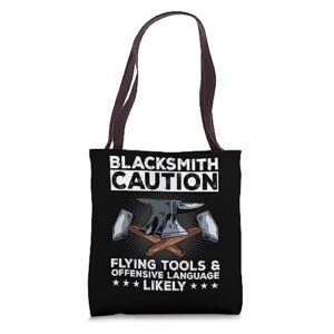 blacksmith caution flying tools anvil forge forging hammer tote bag