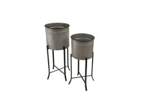 creative co-op farmhouse round corrugated metal planters on stands, set of 2 sizes, silver and black