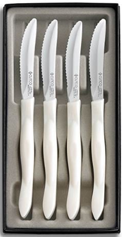 CUTCO #1865 set of 4 White (Pearl) Model 1759 Table Knives, each in a factory sealed plastic bag, inside attractive blue CUTCO box..............3.8" Double-D® serrated 440A High-Carbon, Stainless Steel blades and 5" handles