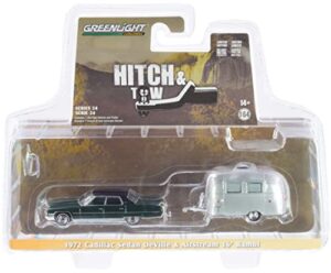 1972 sedan deville brewster green met. w/black top & airstream 16’ bambi travel trailer hitch & tow 1/64 diecast model car by greenlight 32240 a