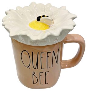 rae dunn magenta finely glazed ceramic coffee mug in salmon with daisy flower lid | inscribed: queen bee daisy with bumble bee on lid