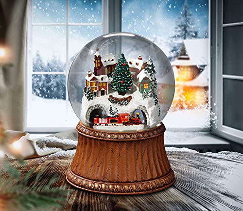 The San Francisco Music Box Company Rotating Train and Mountain Village Snow Globe