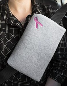 the breast and chest buddy mastectomy pillow and seatbelt cushion for mastectomy and breast reconstruction sites gray with pink ribbon