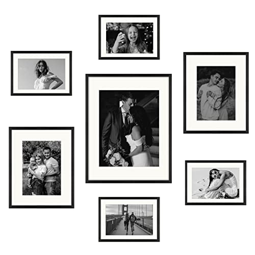 Frametory, Aluminum Gallery Wall Frame Set with Ivory Color Mat - 7 Pack of Metal Picture Frames with Real Glass - Four 5x7, Two 8x10, One 11x14 - Great for Photos, Artworks, Posters (Black)