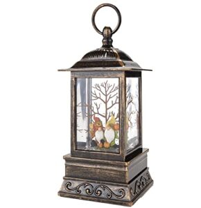 lighted harvest lantern with gnome motif and swirling faux snow