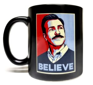 mean muggin believe - 11oz ceramic black mug - artwork on both sides - funny - giftable foam box protection - inspired by ted lasso