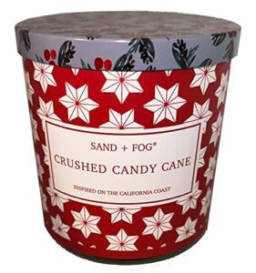 sand + fog candle crushed candy cane in a 11.5 oz. glass jar - metal lid with images of holly and berries