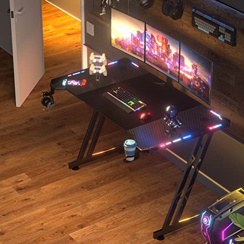 HLDIRECT 63 Inch Gaming Desk with LED Lights Carbon Fibre Surface Gaming Table Large Computer Desk Ergonomic Home Office Desks Z Shaped PC Gamer Workstations with Cup Holder & Headphone Hook Black