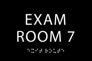 black ada exam room 7 sign - made from durable acrylic and ready to mount