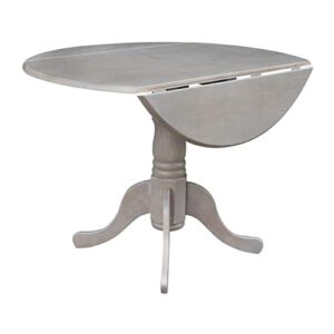 international concepts 42" round dual drop leaf pedestal table, washed gray taupe