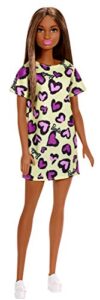 ​barbie doll, brunette, wearing yellow and purple heart-print dress and platform sneakers, for 3 to 7 year olds