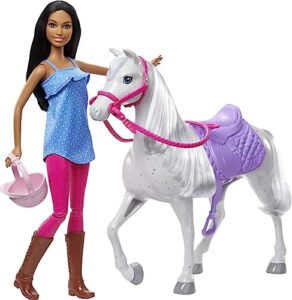 barbie doll and horse, bendable brunette doll with riding outfit and boots, white horse with saddle, bridle and reins
