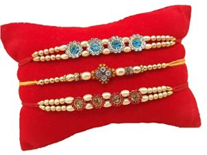 palak global rakhi bracelet, wrist band. fancy unique beautiful stones blue white, red stones, gift celebration (fancy rakhi set of 3 - design 1, small) (plk32)