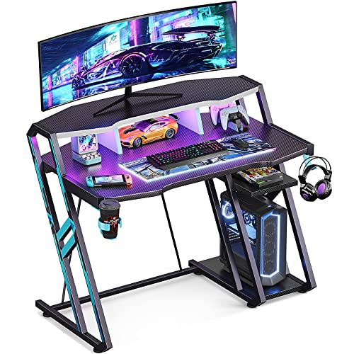 MOTPK Full-Sized Monitor Shelf Gaming Desk with LED Lights 39 Inch, Gaming Table with Storage Shelf, Ergonomic Gamer Desk with Carbon Fiber Texture, Computer Desk with Stable Frame, Black, Gift Idea