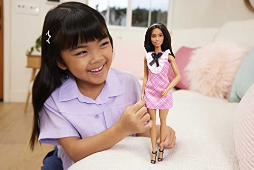 Barbie Fashionistas Doll #209 with Black Hair Wearing a Pink Plaid Dress, Pearlescent Headband and Strappy Heels, 3 years and older