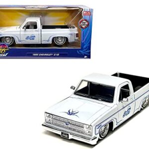 Jada Toys 1985 Chevy C10 Pickup Truck Lowrider White Metallic with Blue Graphics Street Low Series 1/24 Diecast Model Car by Jada 34313