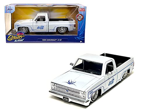 Jada Toys 1985 Chevy C10 Pickup Truck Lowrider White Metallic with Blue Graphics Street Low Series 1/24 Diecast Model Car by Jada 34313