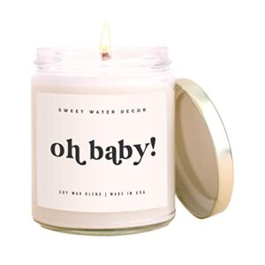 sweet water decor, oh baby! jasmine, cream, and wood scented soy wax candle for home | 9oz clear jar on beige ecru label, 40 hour burn time, made in the usa