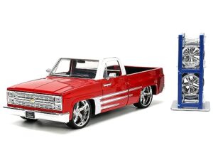 1985 chevy c-10 pickup truck red with white top and graphics with extra wheels just trucks series 1/24 diecast model car by jada 34179