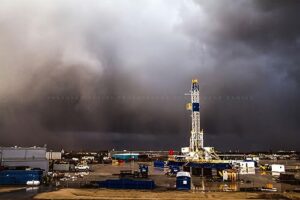 oilfield photography print (not framed) picture of thunderstorm passing behind drilling rig on stormy day in oklahoma oil and gas wall art energy decor (16" x 20")