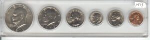 1973 birth year coin set- 6 coins- eisenhower dollar, kennedy half dollar, quarter, dime, nickel, and cent- all dated 1973 and displayed in a hard plastic case- coins are uncirculated