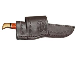 custom cross draw knife sheath for buck 102 knife. the sheath is made out of 10 ounce water buffalo hide leather the leather is soft pliable and very durable. this sheath can be worn on the right or left hand side. it is died dark brown with border toolin