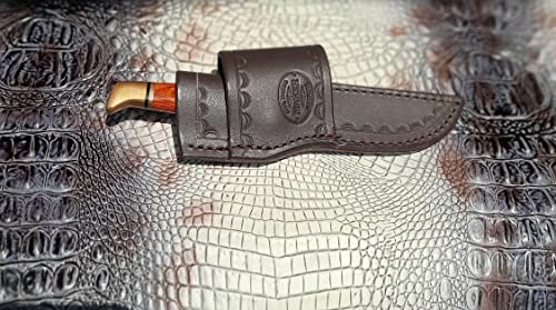 Custom Cross Draw Knife Sheath for Buck 102 Knife. The Sheath Is Made Out of 10 Ounce Water Buffalo Hide Leather the Leather Is Soft Pliable and Very Durable. This Sheath Can Be Worn on the Right or Left Hand Side. It Is Died Dark Brown with Border Toolin