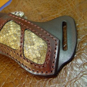 Buck 110 Rattlesnake Right-hand Cross Draw Knife Sheath. The Sheath Is Made Out of 10 Ounce Water Buffalo Leather and a Rattlesnake Insert. It is Made to Wear on Your Left-Side and Drawn with Your Right Hand the Sheath Is Dyed Dark Brown. Sheath Only the