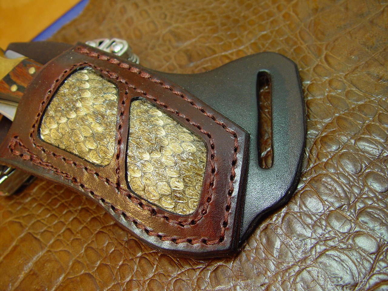 Buck 110 Rattlesnake Right-hand Cross Draw Knife Sheath. The Sheath Is Made Out of 10 Ounce Water Buffalo Leather and a Rattlesnake Insert. It is Made to Wear on Your Left-Side and Drawn with Your Right Hand the Sheath Is Dyed Dark Brown. Sheath Only the