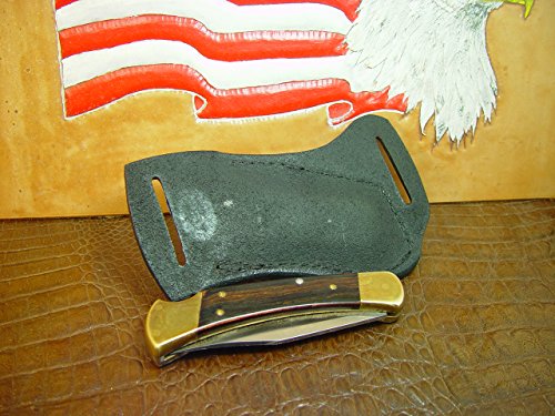 Buck Custom Left Hand Cross Draw Knife Sheath for a 110 Knife. The Sheath is Made Out of Buffalo Hide Leather Hand Tooled with a Basket Weave Pattern.