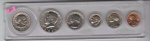 1980 birth year coin set (6) coins dollar, half dollar, quarter, dime, nickel, and cent - all dated 1980 and encased in a plastic display holder uncirculated