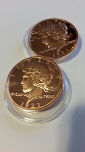 two pack of 1 ounce peace dollar copper coins